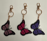 Pink Cowgirl Hat or Butterfly Keychain – Supporting Dolly Parton’s Imagination Library